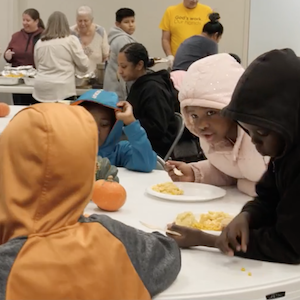 Neighbors share a meal at the Harvest Feast